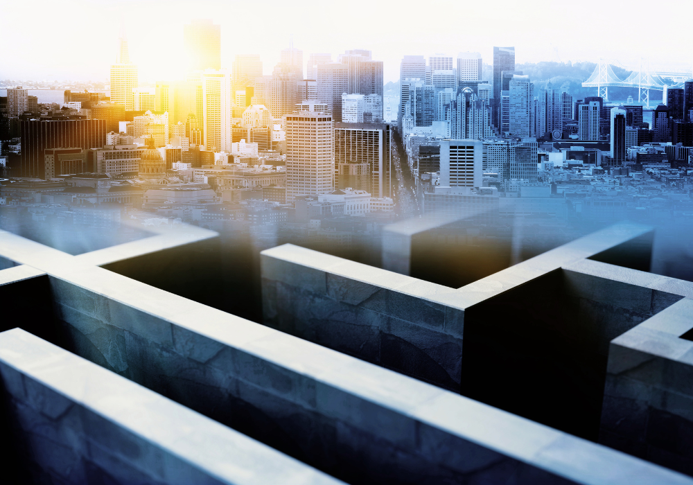 A image of a maze underneath the image of a bustling city 