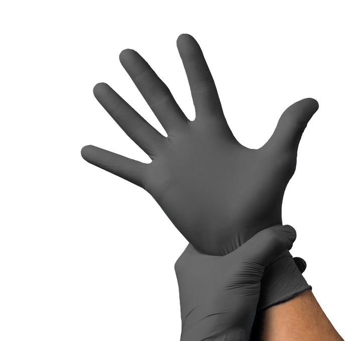 A person wearing a black nitrile exam glove.